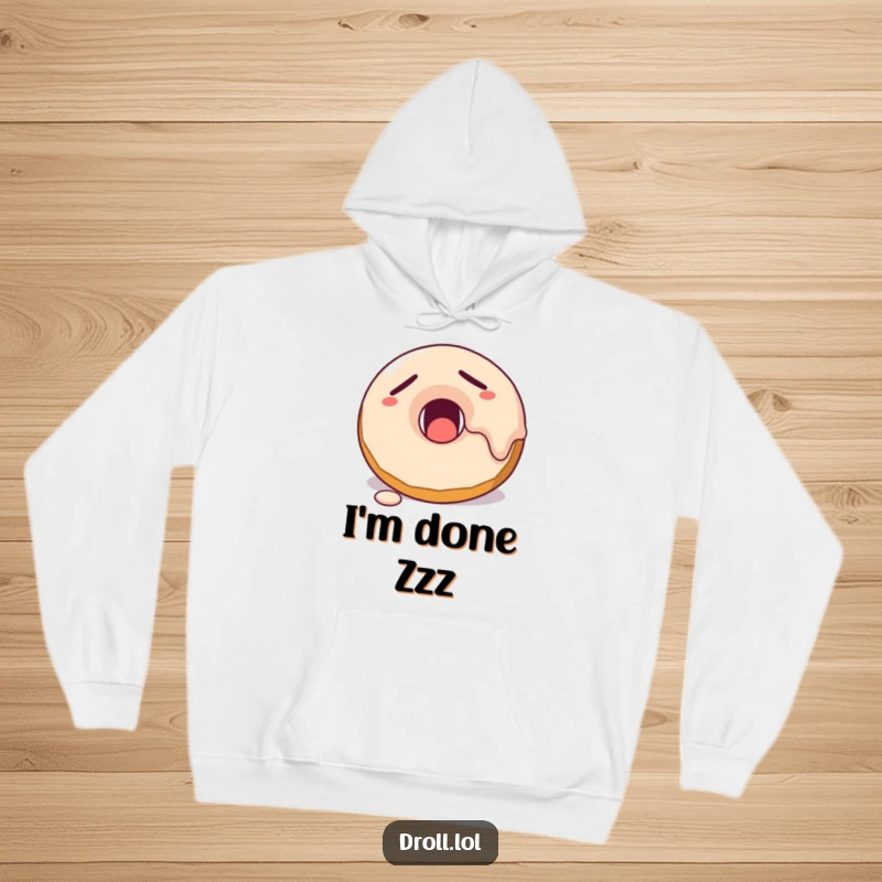 Funny sleepy donut character yawning, with frosting dripping, depicted on a super soft and cozy hoodie.