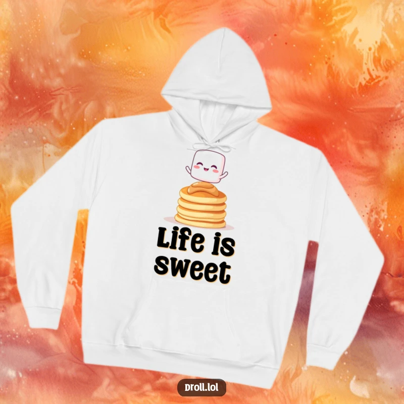 Funny hoodie with a giggling marshmallow character balancing on pancakes, perfect for warmth and sweet smiles.