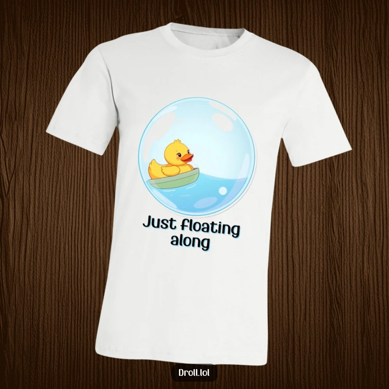 Funny t-shirt graphic of a yellow rubber duck cheerfully sailing inside a huge, translucent bubble like a tiny boat.