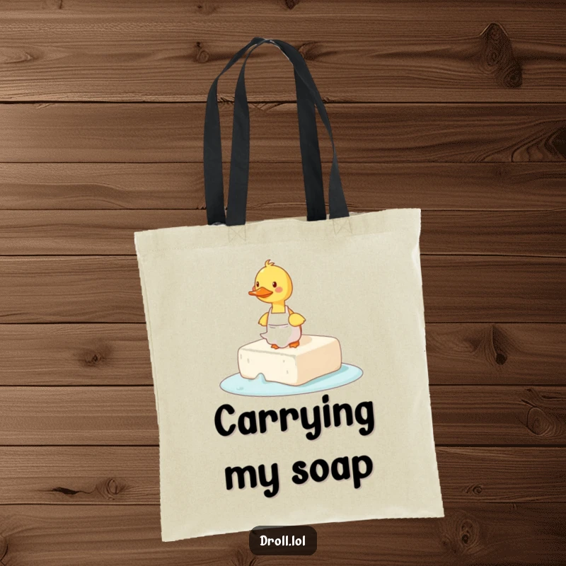 Funny tote bag showing a duck wearing an apron tripping on a large, slippery bar of soap.