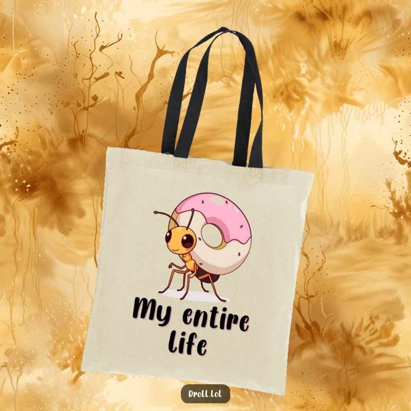Funny tote bag showcasing a tiny, determined ant struggling but succeeding to carry a massive donut, highlighting incredible effort.